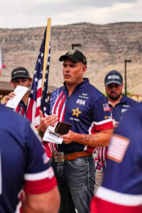 Kahl Harmon Holding Flag at 2024 World Championship Rifle Match